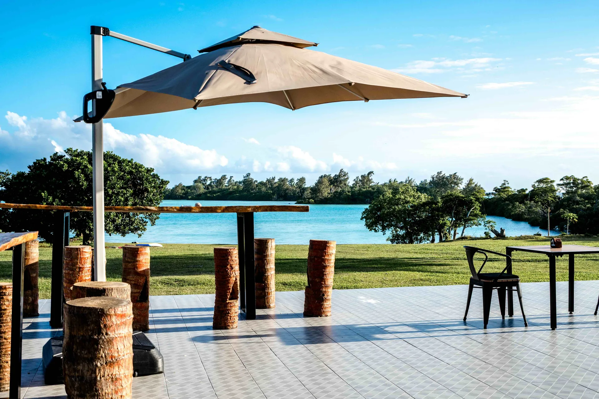 Romantic beachfront dining under umbrella at Nawesa Resort Efate Island Vanuatu