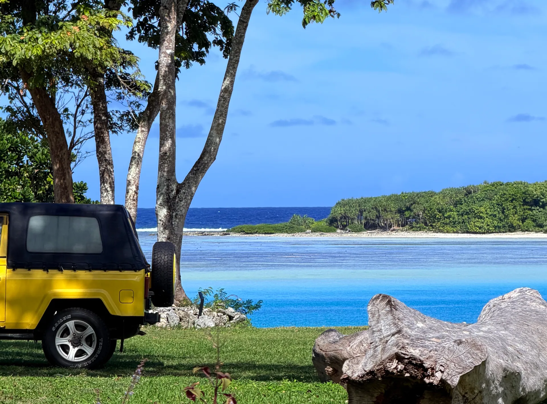 Jeep parked by lagoon