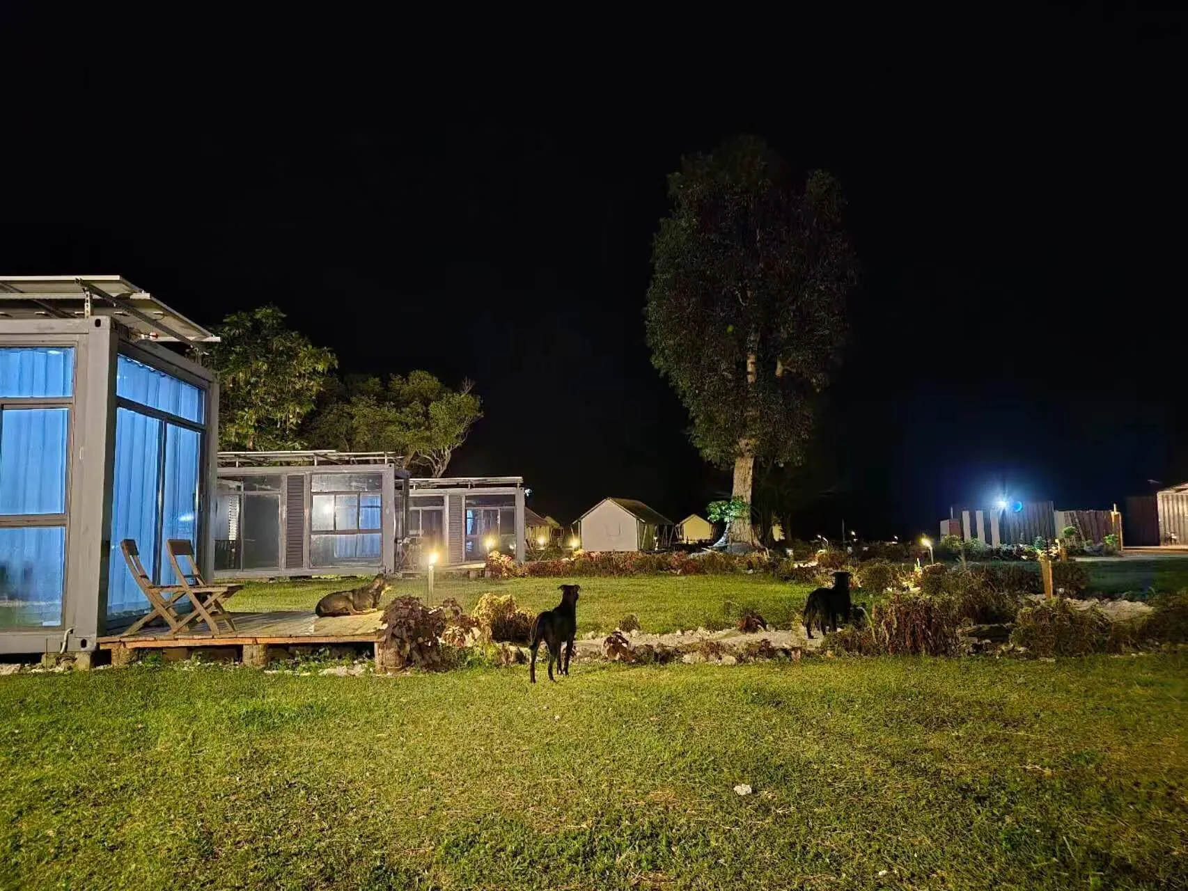Ocean view suite house illuminated at night at Nawesa beachfront resort Efate
